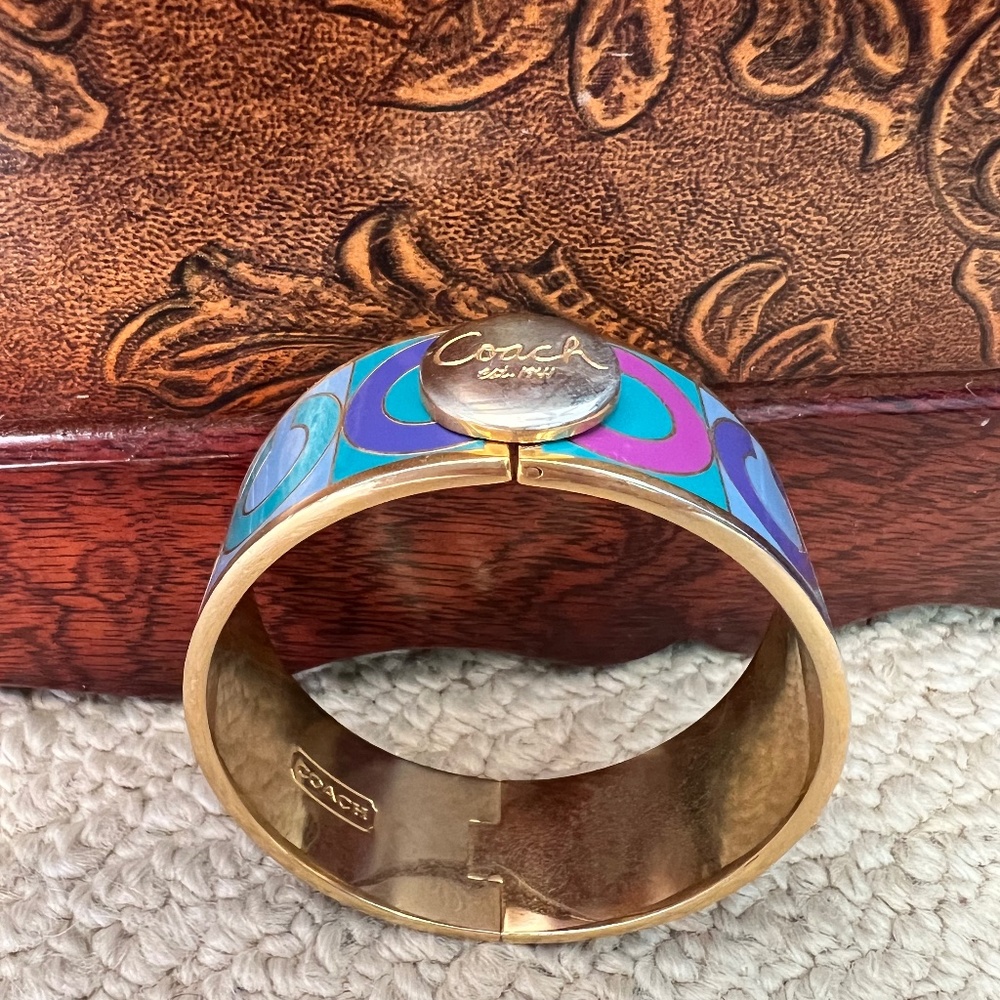 Gold toned Coach Bangle Bracelet with “C” logo motif